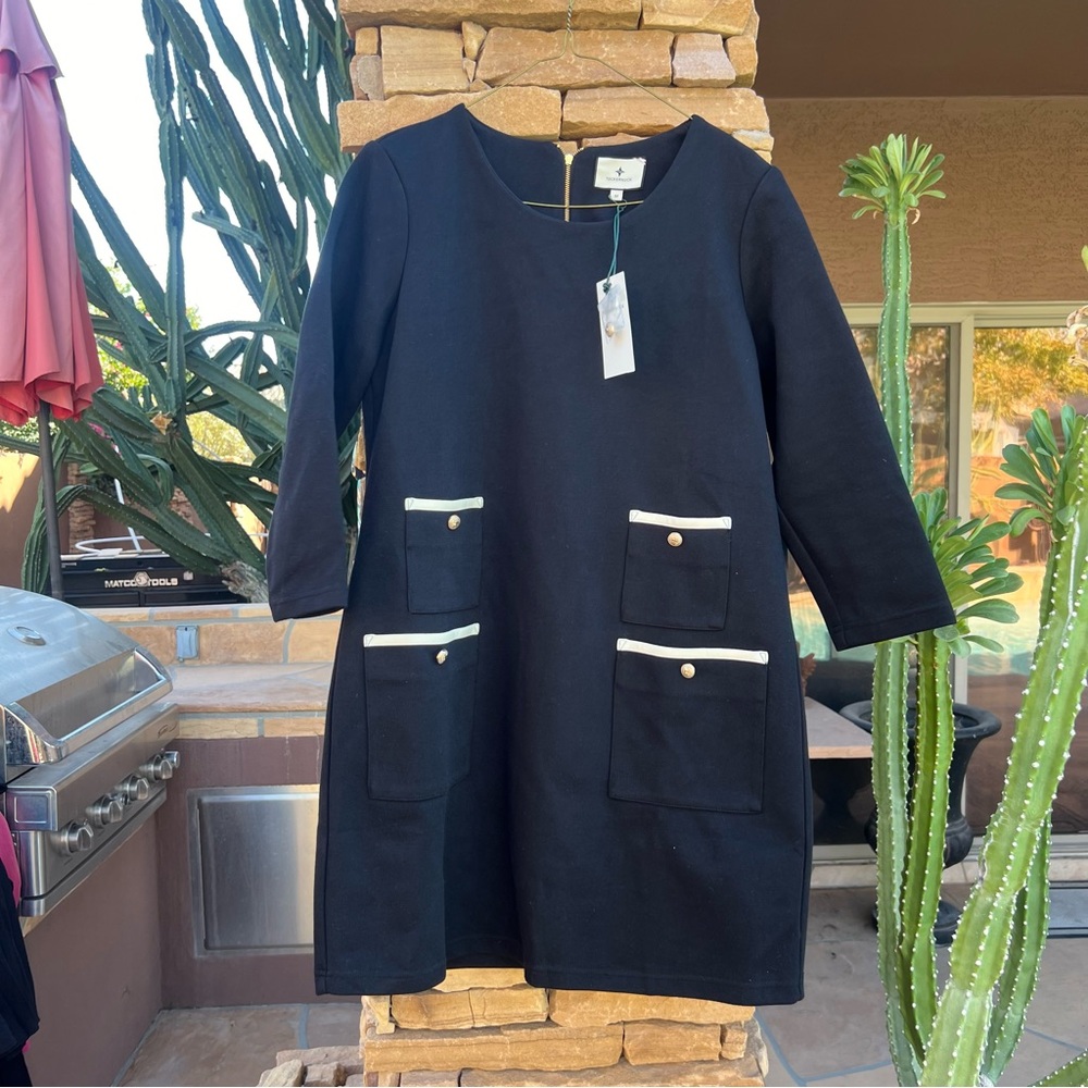 Navy blue Tuckernuck dress with white piping on pockets